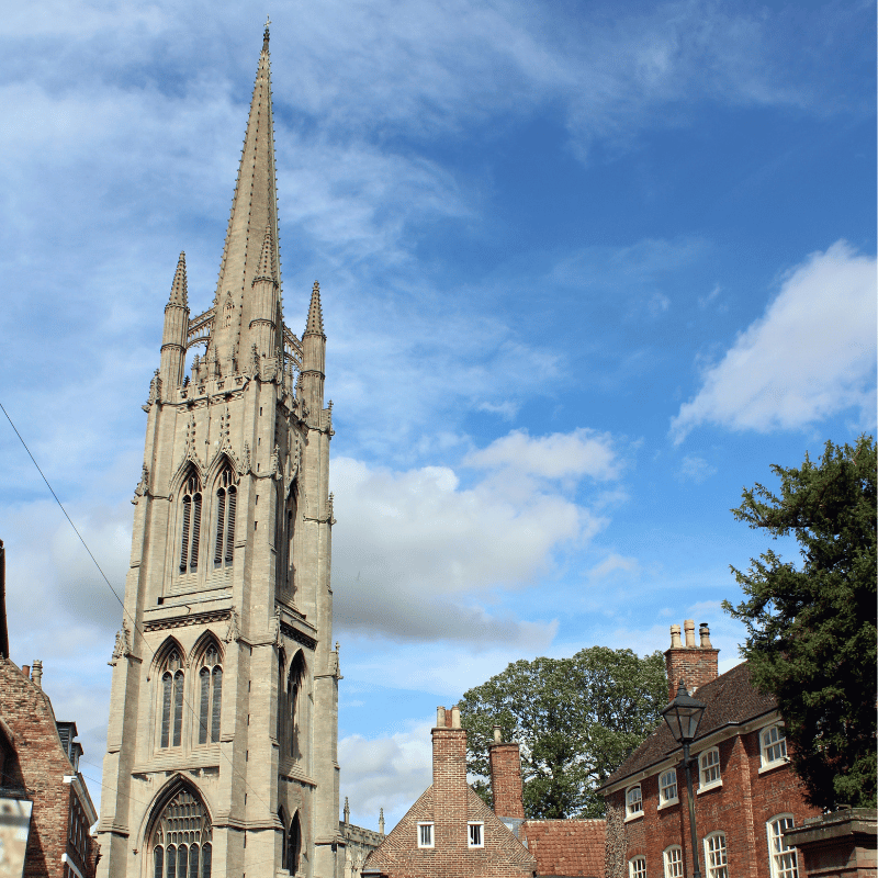 A church steeple in Louth with blue sky and clouds